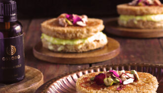 Rasmalai Frech Toast filled with Kesar Rabdi on a copper plate on a wooden table