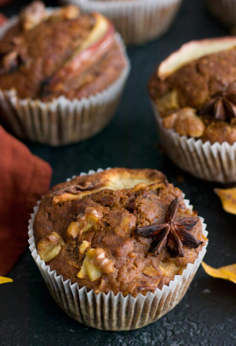 Eggless Apple Muffins over a black table